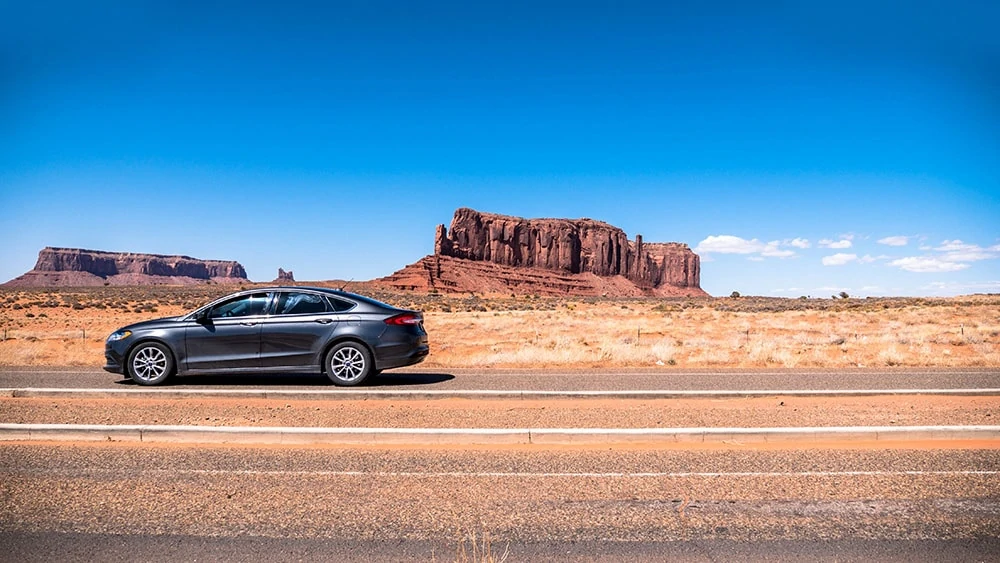 A car with completed window tinting parked in the Arizona sun