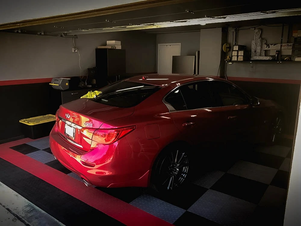 An Infiniti sedan after a full window tint installation